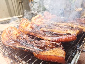 Close-up of meat on barbecue grill