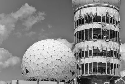 Low angle view of building against cloudy sky