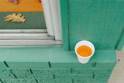 High angle view of drink on wall