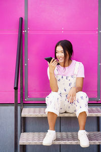 Young woman using mobile phone