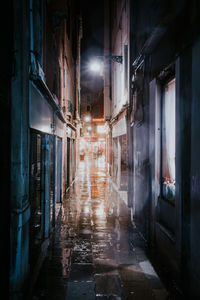 Empty alley amidst buildings in city