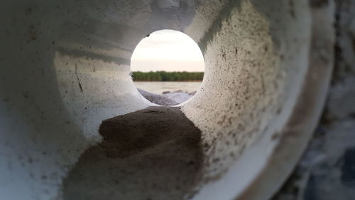 Close-up of sand against sky