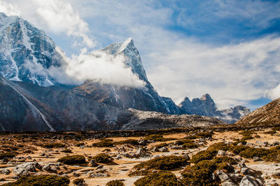 Scenic view of snowcapped mountains against sky