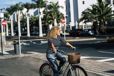 Woman riding bicycle in city