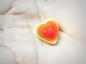 Close-up of hand holding heart shape