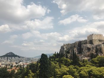 Panoramic view of trees and mountains against sky