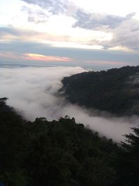 Scenic view of mountains against sky at sunset