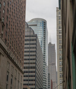 Low angle view of buildings in city against sky