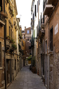 Narrow alley with traditional colorful houses - venice, veneto, italy