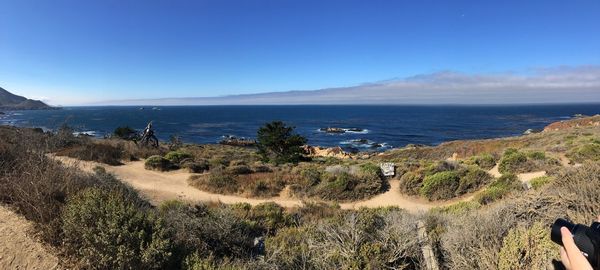 Scenic view of sea against blue sky