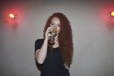 Portrait of a young woman at a nightclub