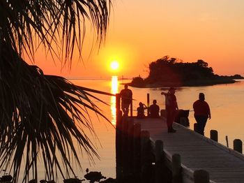 Silhouette of palm trees at sunset