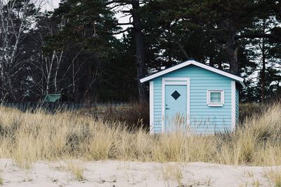 Beach house against trees