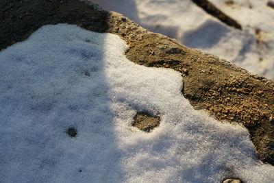 High angle view of snow on shore