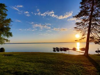 Scenic view of lake against sky during sunset