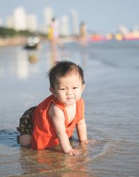 Portrait of smiling boy in water