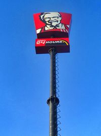 Low angle view of pole against clear blue sky