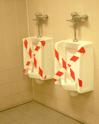 Close-up of urinals 