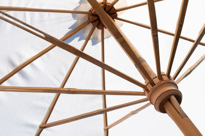 Low angle view of metallic structure against sky