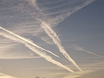 Low angle view of vapor trails in sky