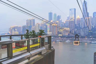 View of suspension bridge with city in background