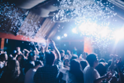 Defocused image of crowd at music concert