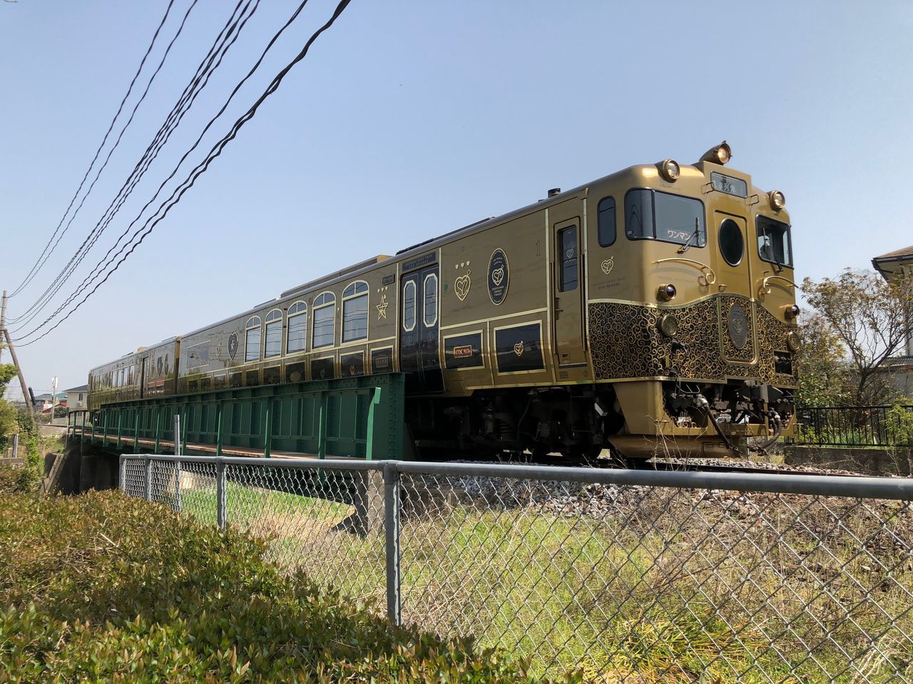 rail transportation, train, sky, train - vehicle, public transportation, mode of transportation, nature, railroad track, track, transportation, day, no people, clear sky, plant, cable, architecture, metal, grass, outdoors, travel, electricity