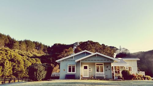 Houses against clear sky