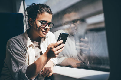 Young man using mobile phone