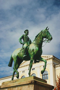 Low angle view of statue against sky