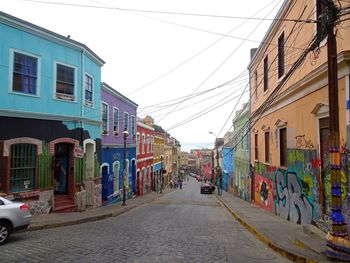 Street amidst buildings against sky