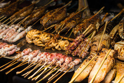 Close-up of meat on barbecue grill