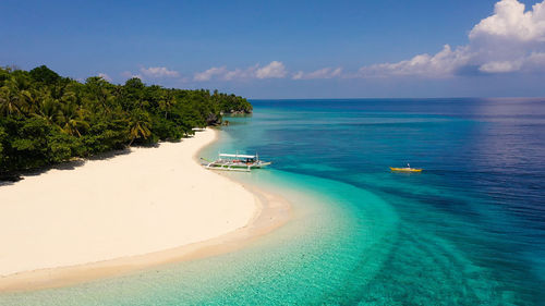 Seascape with a beautiful tropical island, aerial view. mahaba island, philippines.
