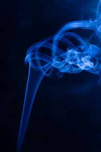 Close-up of blue water against black background