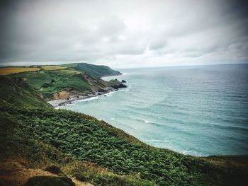 Scenic view of sea against cloudy sky