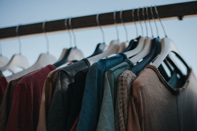 Close-up of clothes hanging on rack