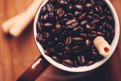 High angle view of coffee beans in bowl