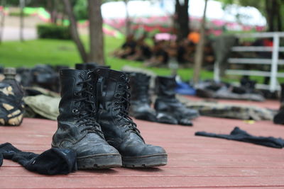 Close-up of boots on footpath