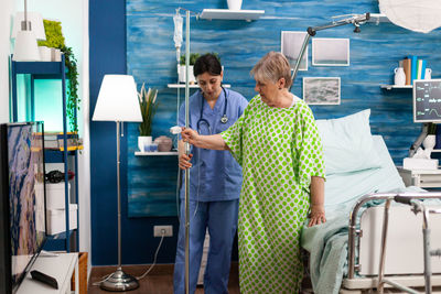 Nurse assisting patient at hospital