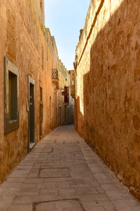 Narrow alley along buildings