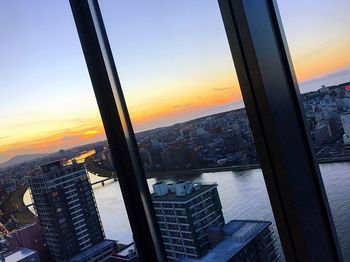 High angle view of buildings against sky during sunset