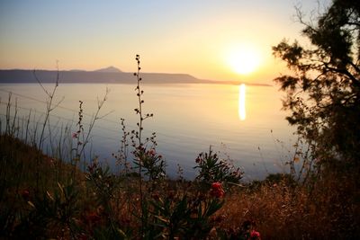 Scenic view of lake against sky during sunset