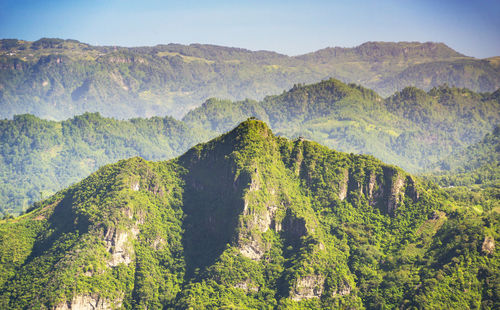 High angle view of trees and mountains against sky