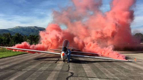 View of plane in front of smoke