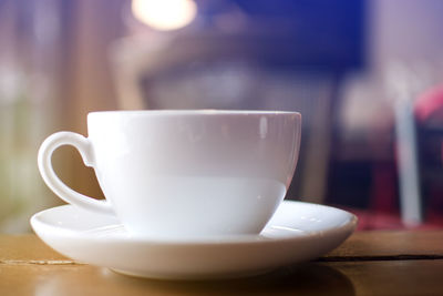 Close-up of coffee cup on table