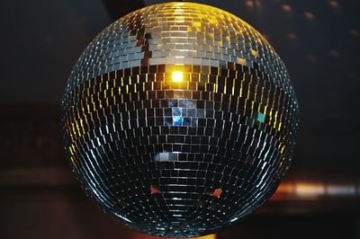 Close-up of illuminated lighting equipment at night