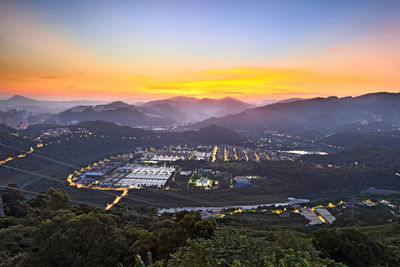 High angle view of cityscape against sky during sunset