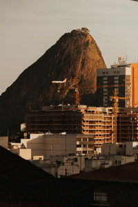 Buildings in city against sky