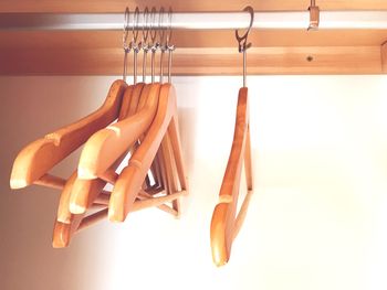 Close-up of clothes hanging on wood