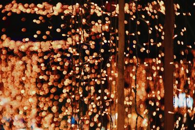 Full frame shot of illuminated lanterns hanging at night